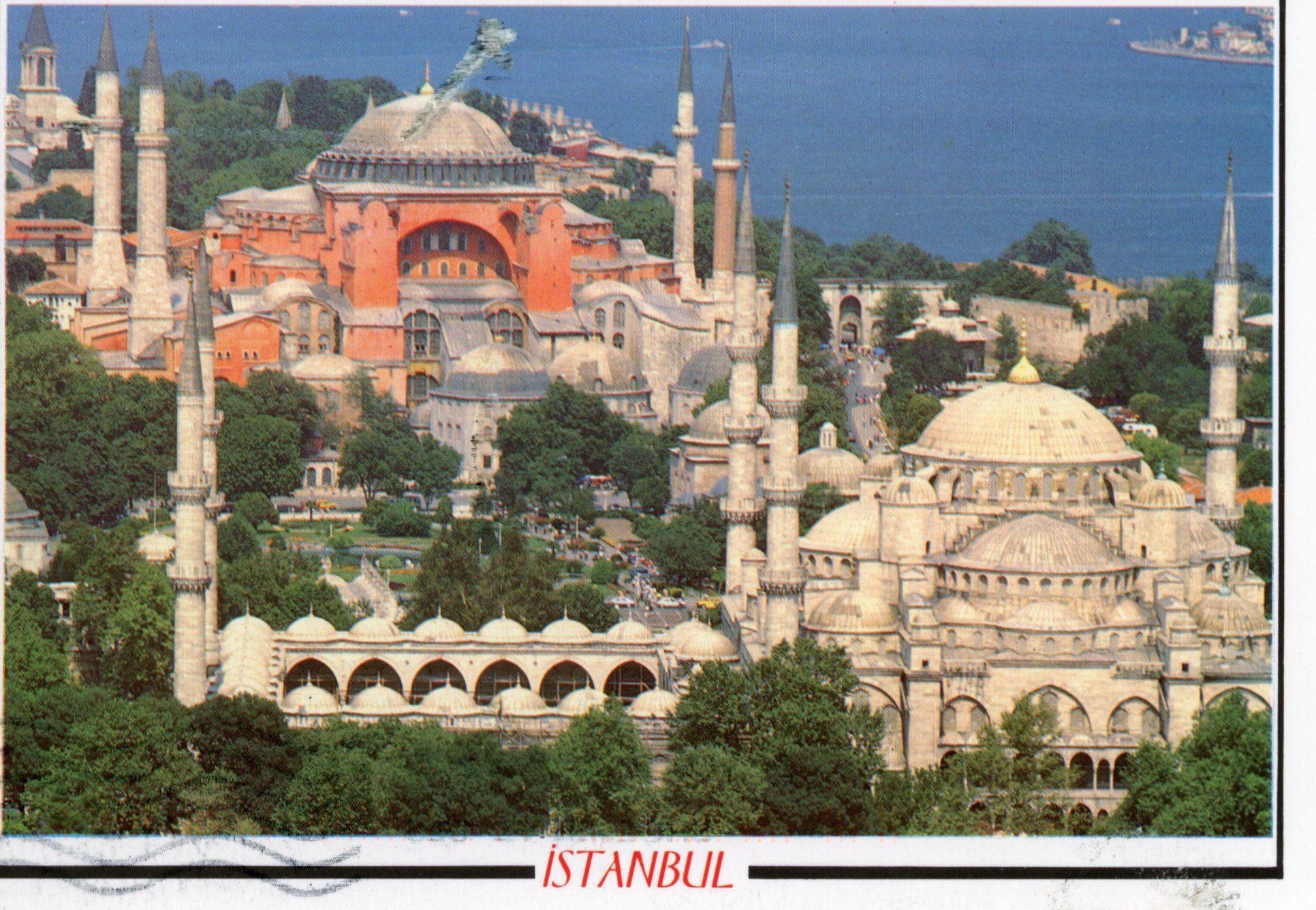 A postcard showing Istanbul's Hagia Sophia and the Blue Mosque. The colors are overly vibrant.
