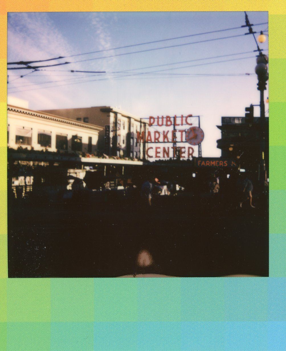 A Polaroid picture of Seattle's iconic Pike Place Market in summer.