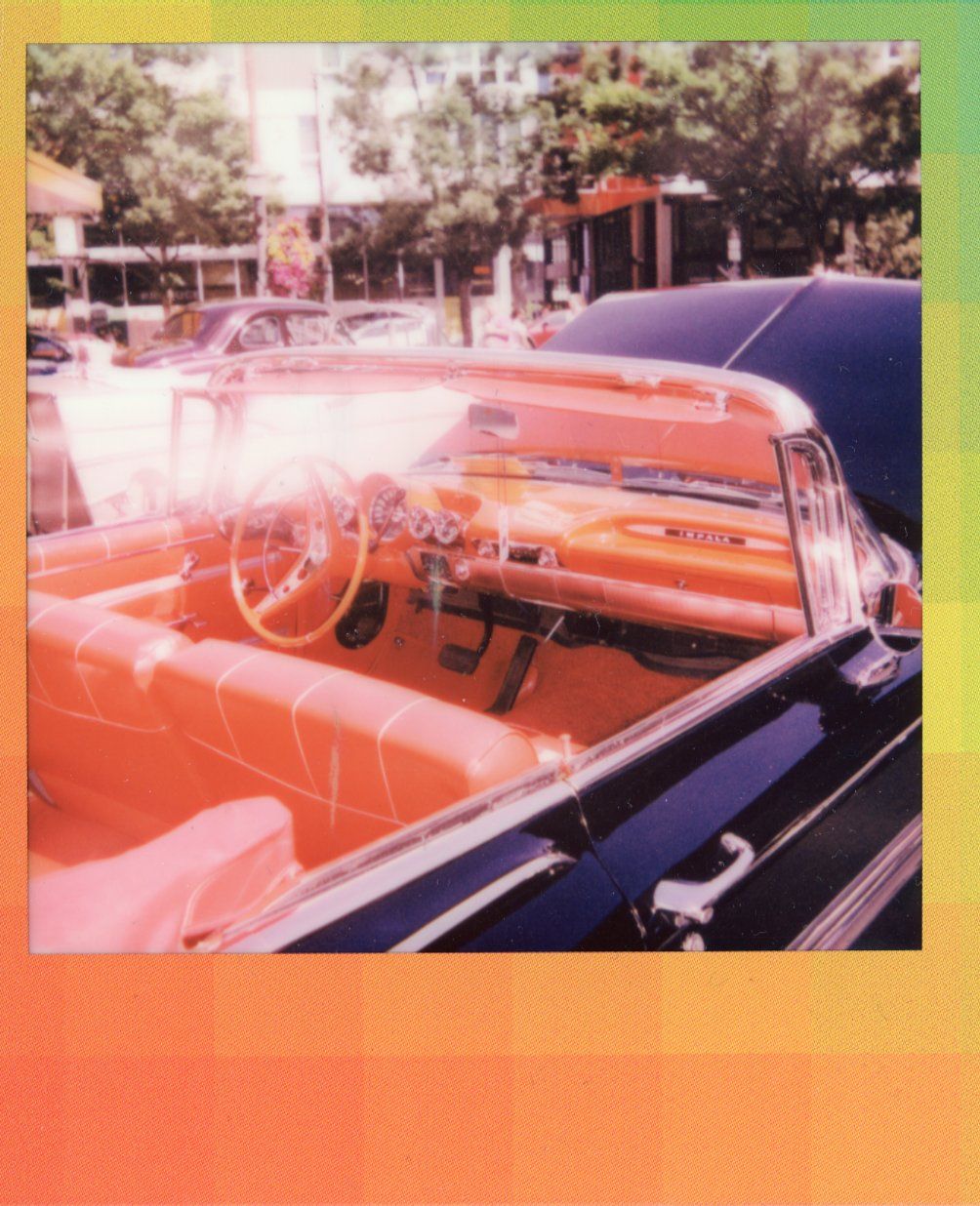 An over-saturated Polaroid of the vibrant interior of a classic car at Dick's Drive-In, Capitol Hill, Seattle, July 2022.