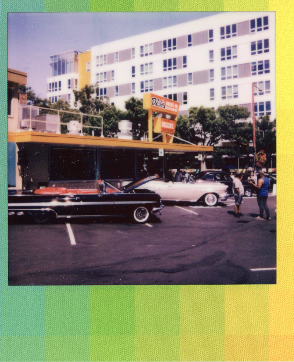 A Polaroid photo of some classic cars outside Dick's Drive-In for their 10 year anniversary, Capitol Hill, Seattle, July 2022.